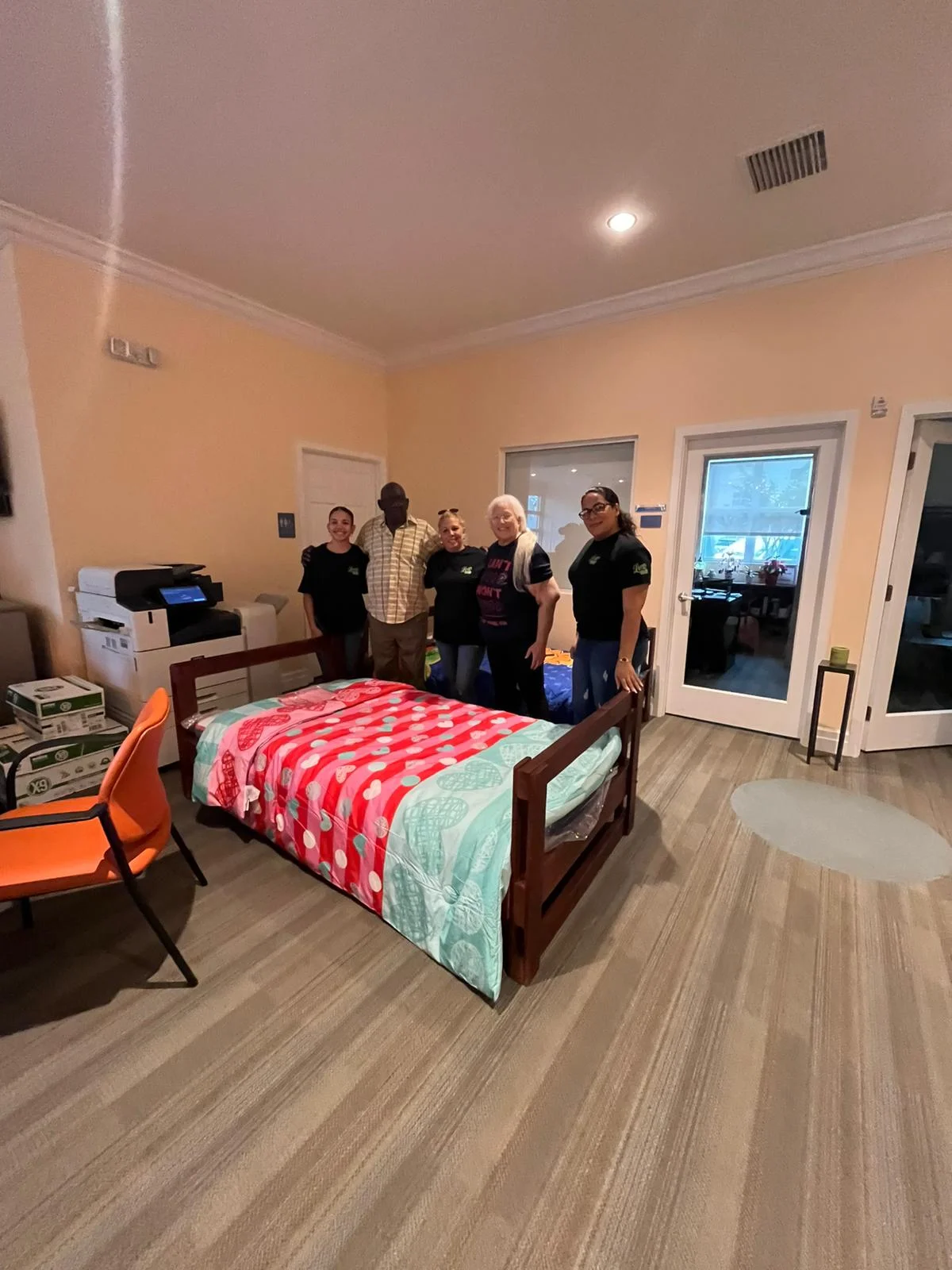 Leon Maid team delivering fresh bedding to a resident